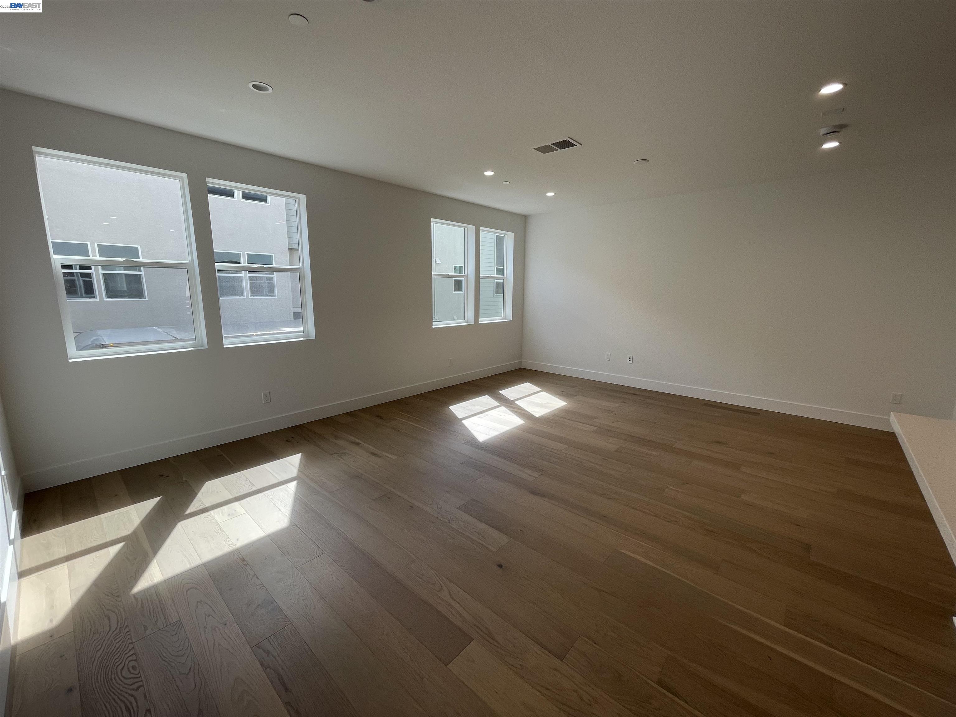 5708 Melon Court San Ramon, CA 94583 - Photo 9 of 31 a view of an empty room with wooden floor and a window