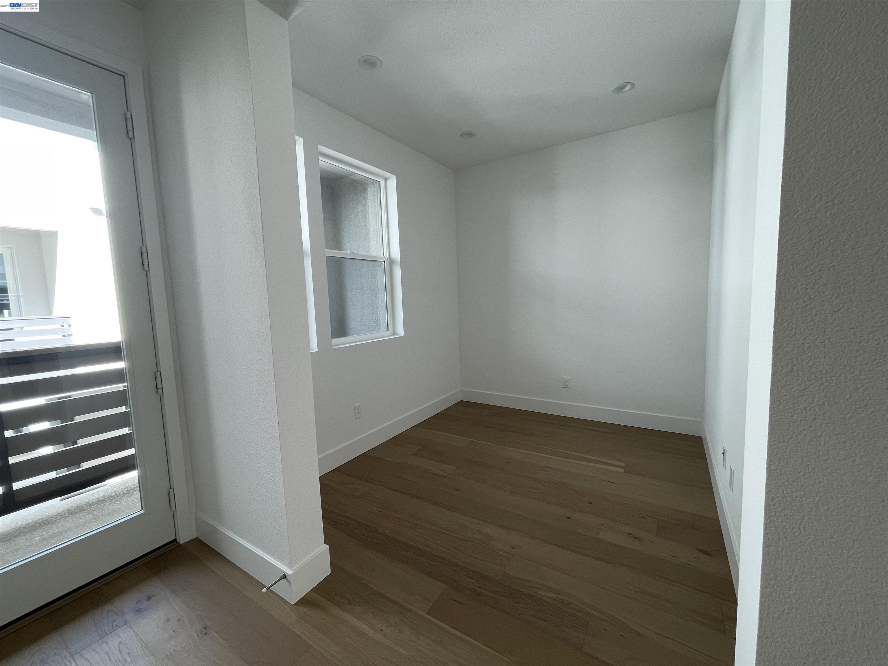 5708 Melon Court San Ramon, CA 94583 - Photo 10 of 31 an empty room with wooden floor and windows