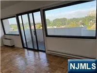 a view of a glass door and a balcony