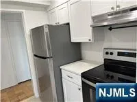 a kitchen with stainless steel appliances a refrigerator and a stove