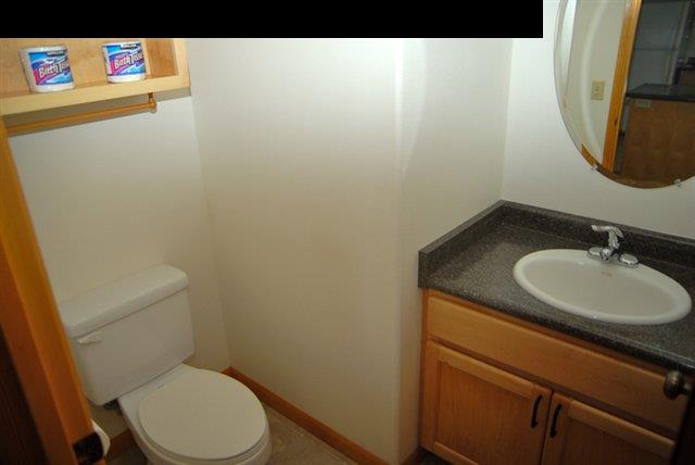 55 Ulumalu Road Haiku, HI 96708 - Photo 16 of 26 a bathroom with a sink a toilet and a mirror