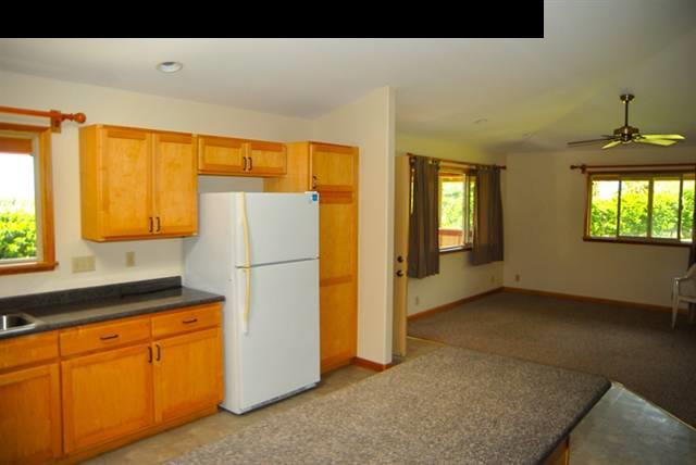 55 Ulumalu Road Haiku, HI 96708 - Photo 6 of 26 a kitchen with window and refrigerator