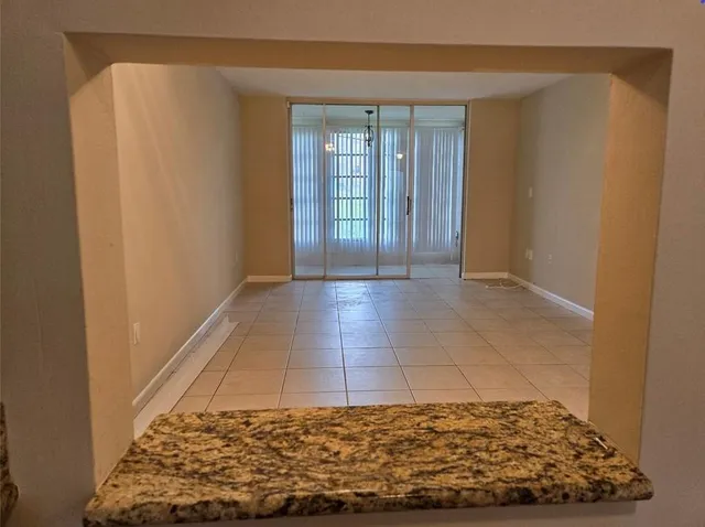 a view of an empty room and window