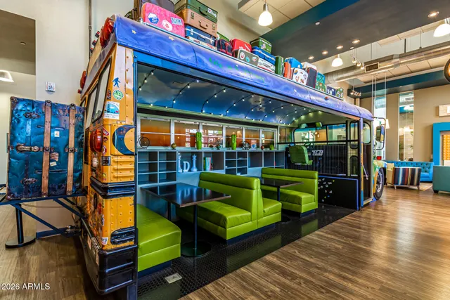 a front view of a house with outdoor seating