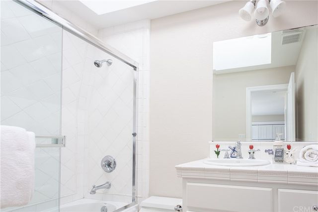 a bedroom with two beds and a large window