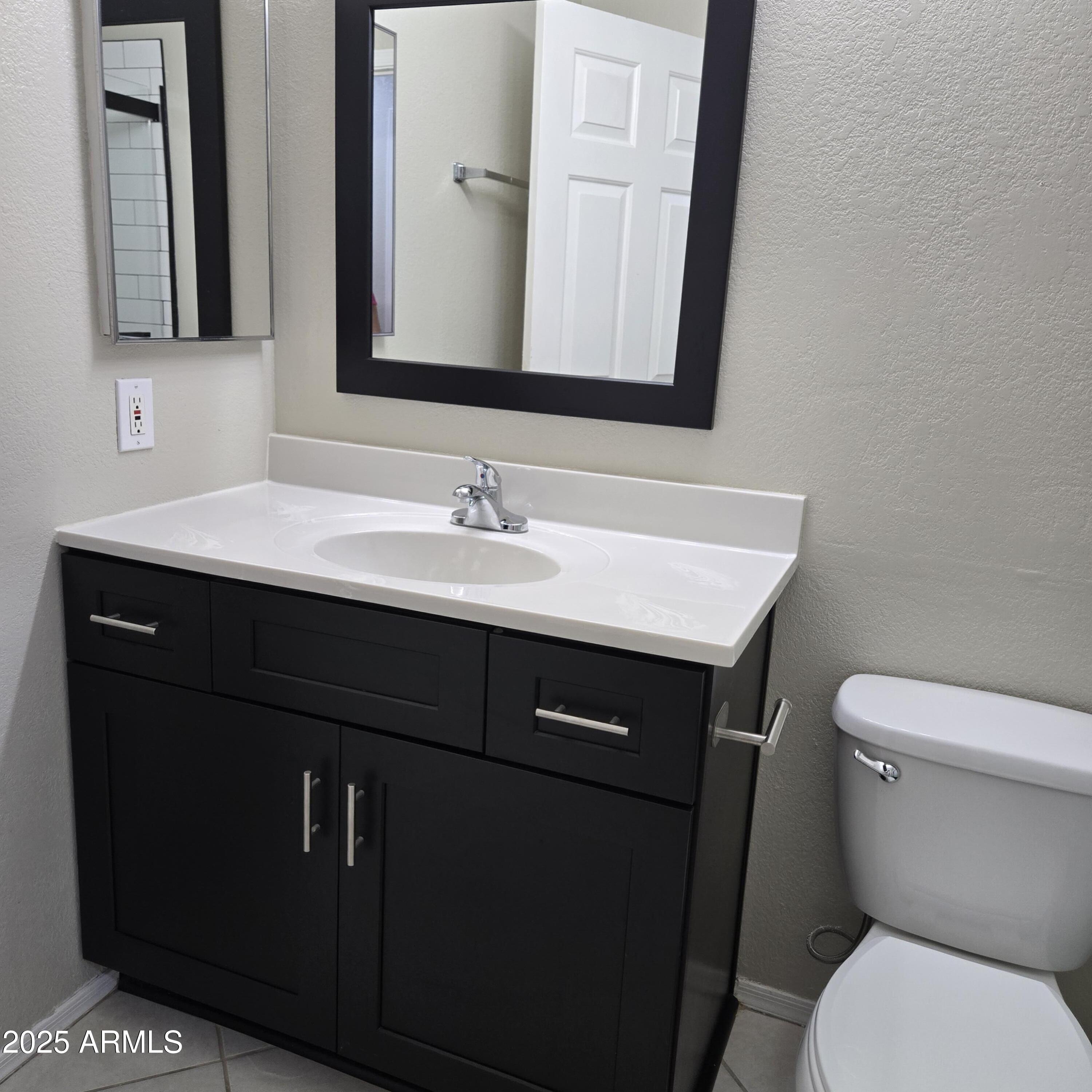 11525 West Cottontail Court Surprise, AZ 85378 - Photo 17 of 21 a bathroom with a sink vanity and a toilet