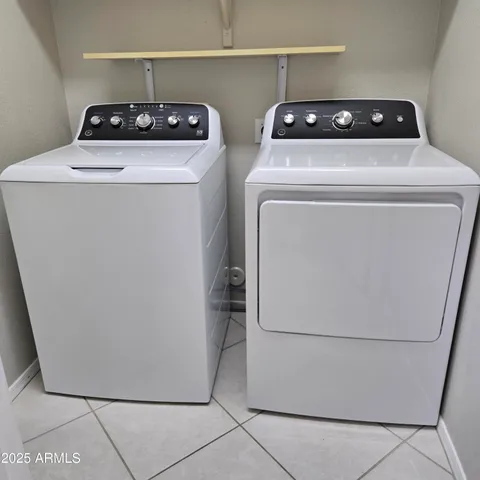 a utility room with washer and dryer