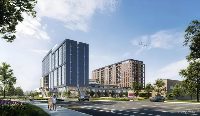 a view of a tall building next to a road