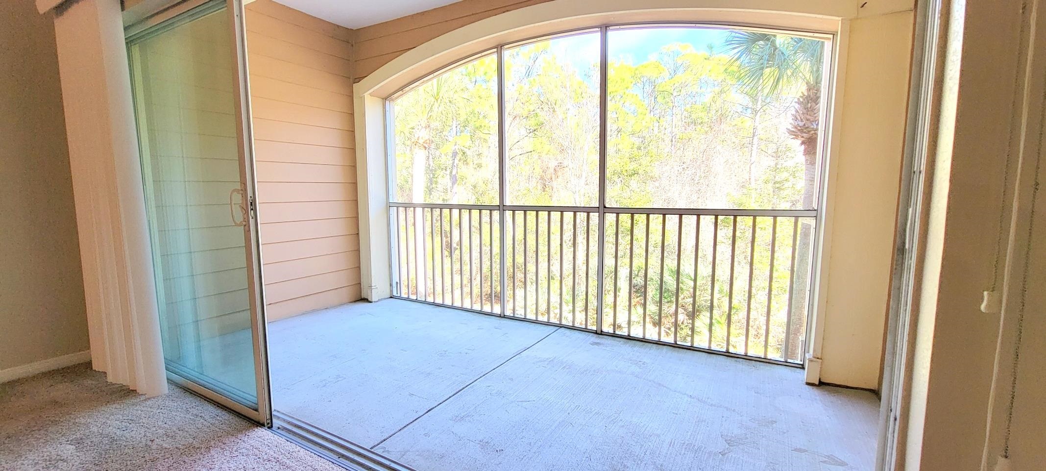 285 Old Village Center Circle, Unit 5206 St. Augustine, FL 32084 - Photo 3 of 17 a view of a room with a large window