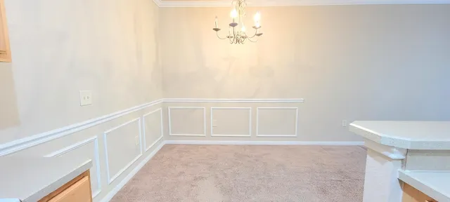 a kitchen with stainless steel appliances a refrigerator a stove a microwave a sink and cabinets