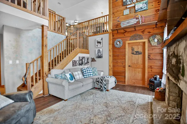 a living room with fireplace furniture and a flat screen tv