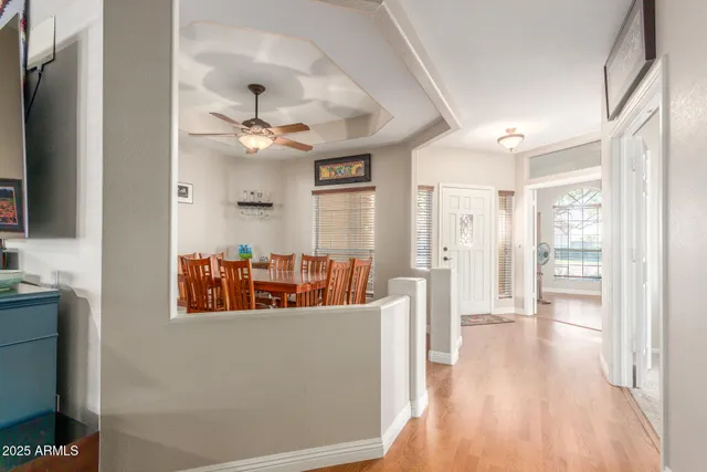 a kitchen with stainless steel appliances kitchen island granite countertop a sink and a refrigerator