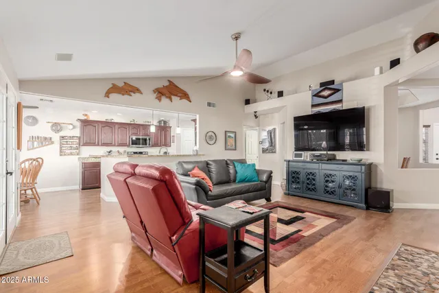 a kitchen with stainless steel appliances granite countertop a sink and a refrigerator