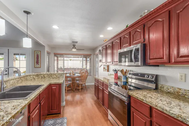 a view of walk in closet with clothes