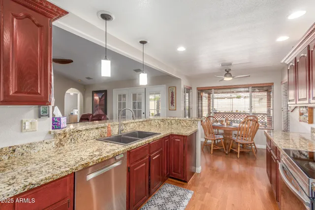 a bedroom with bed and a chandelier