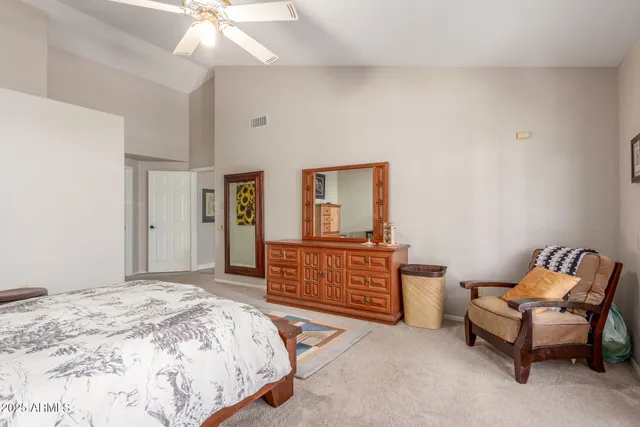 a bathroom with a toilet a sink and a mirror