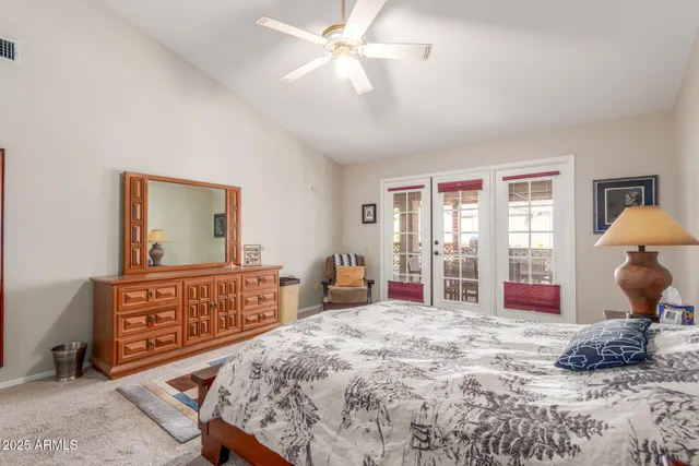 a living room with furniture a flat screen tv and a window
