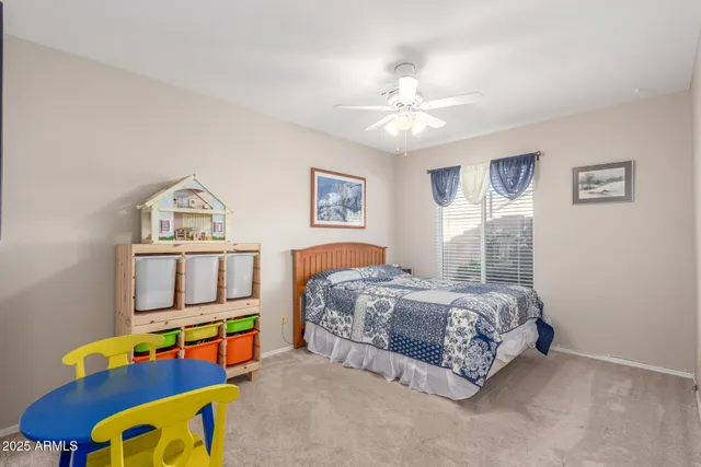 a view of a swimming pool with a patio and a garden