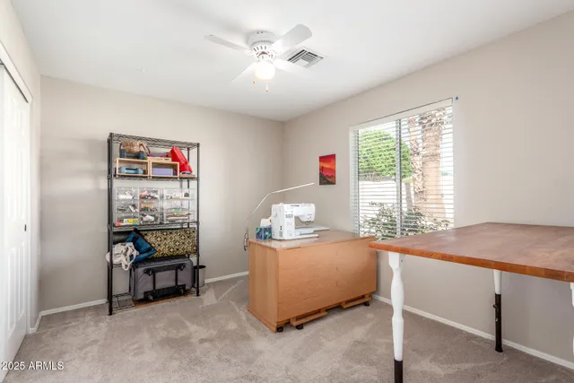 a view of a white house in front of a big yard