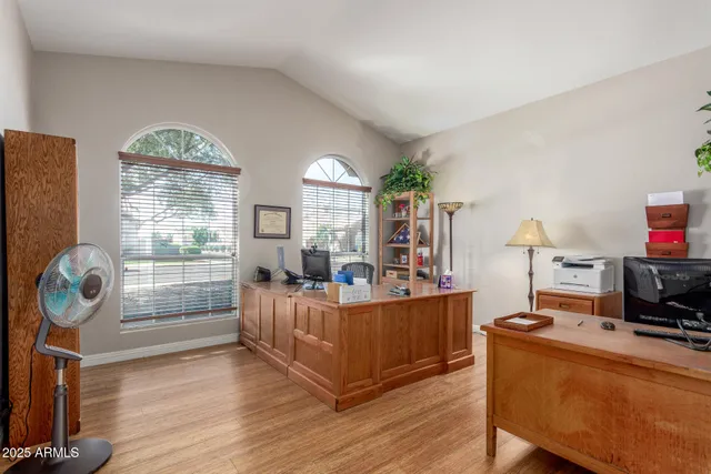 a view of a house with a yard and sitting area