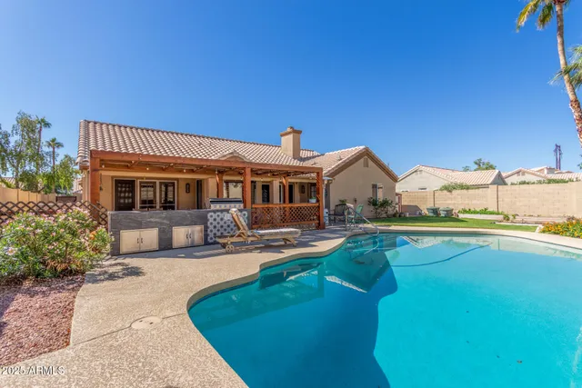 an aerial view of residential houses with outdoor space and street view