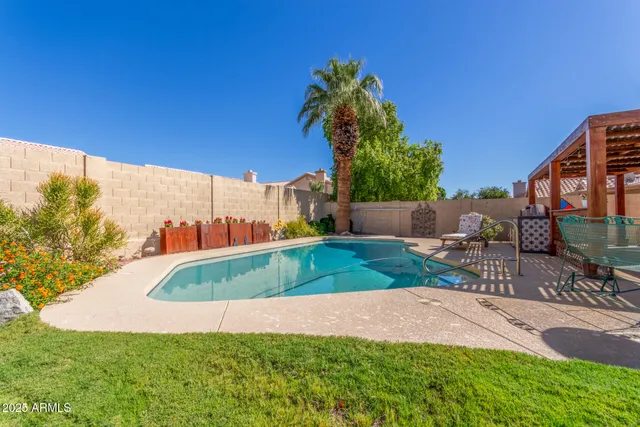 an aerial view of a city with lots of residential buildings and ocean view