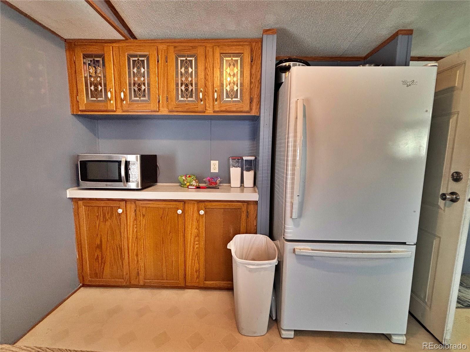 230 North 2nd Street Berthoud, CO 80513 - Photo 17 of 44 a white refrigerator freezer sitting in a kitchen