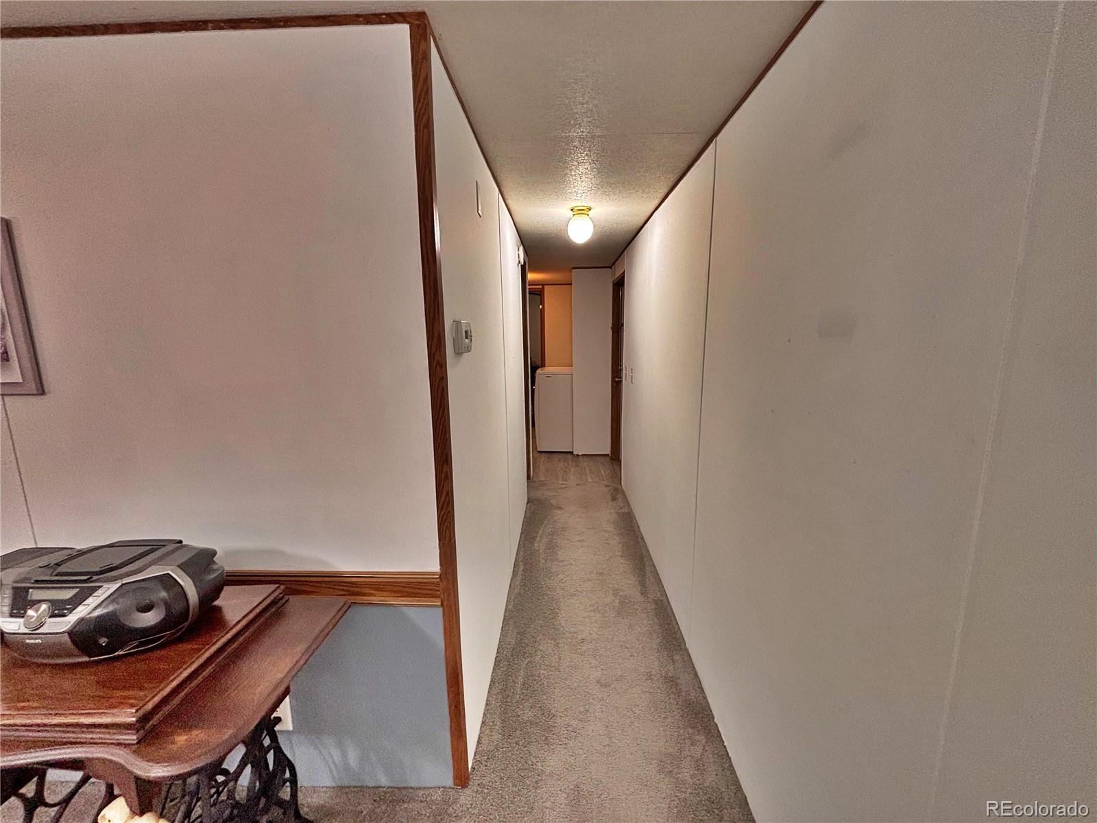 230 North 2nd Street Berthoud, CO 80513 - Photo 22 of 44 a view of a hallway with workspace