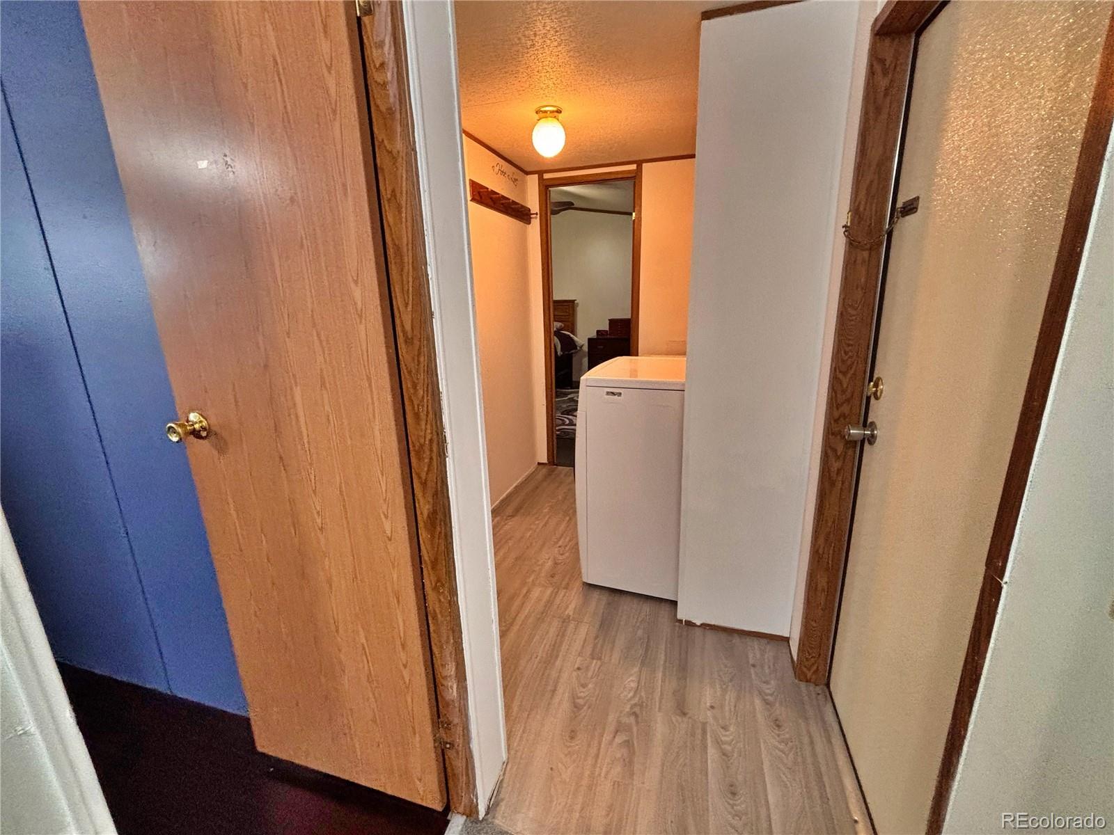 230 North 2nd Street Berthoud, CO 80513 - Photo 24 of 44 a view of hallway with wooden floor