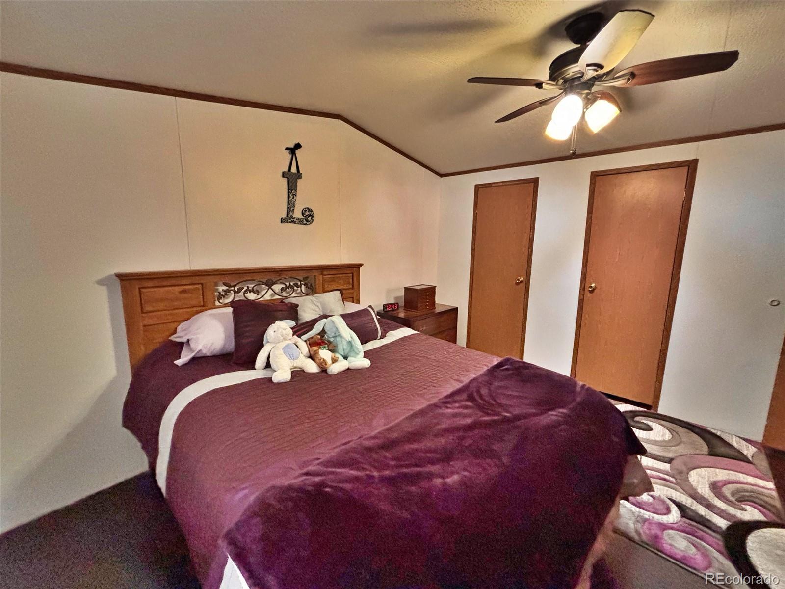 230 North 2nd Street Berthoud, CO 80513 - Photo 37 of 44 a bed sitting in a bedroom next to a window