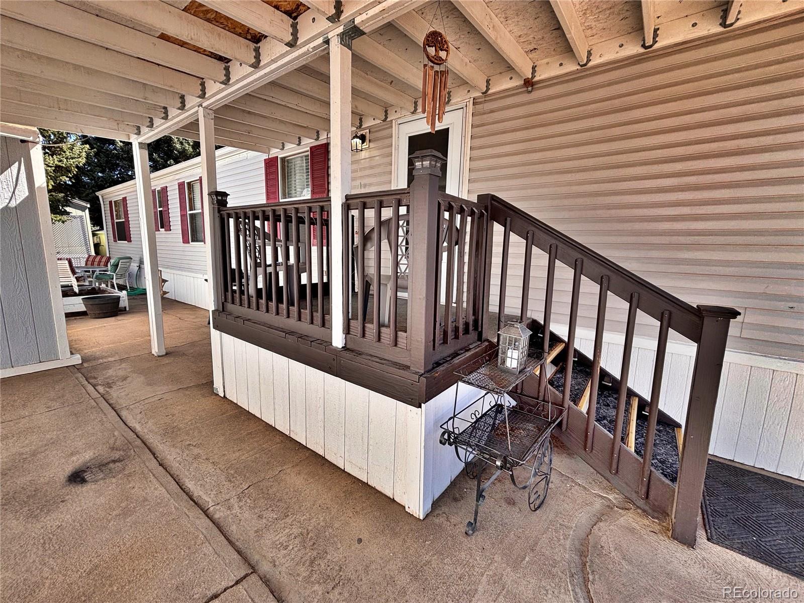 230 North 2nd Street Berthoud, CO 80513 - Photo 5 of 44 a view of a porch with furniture