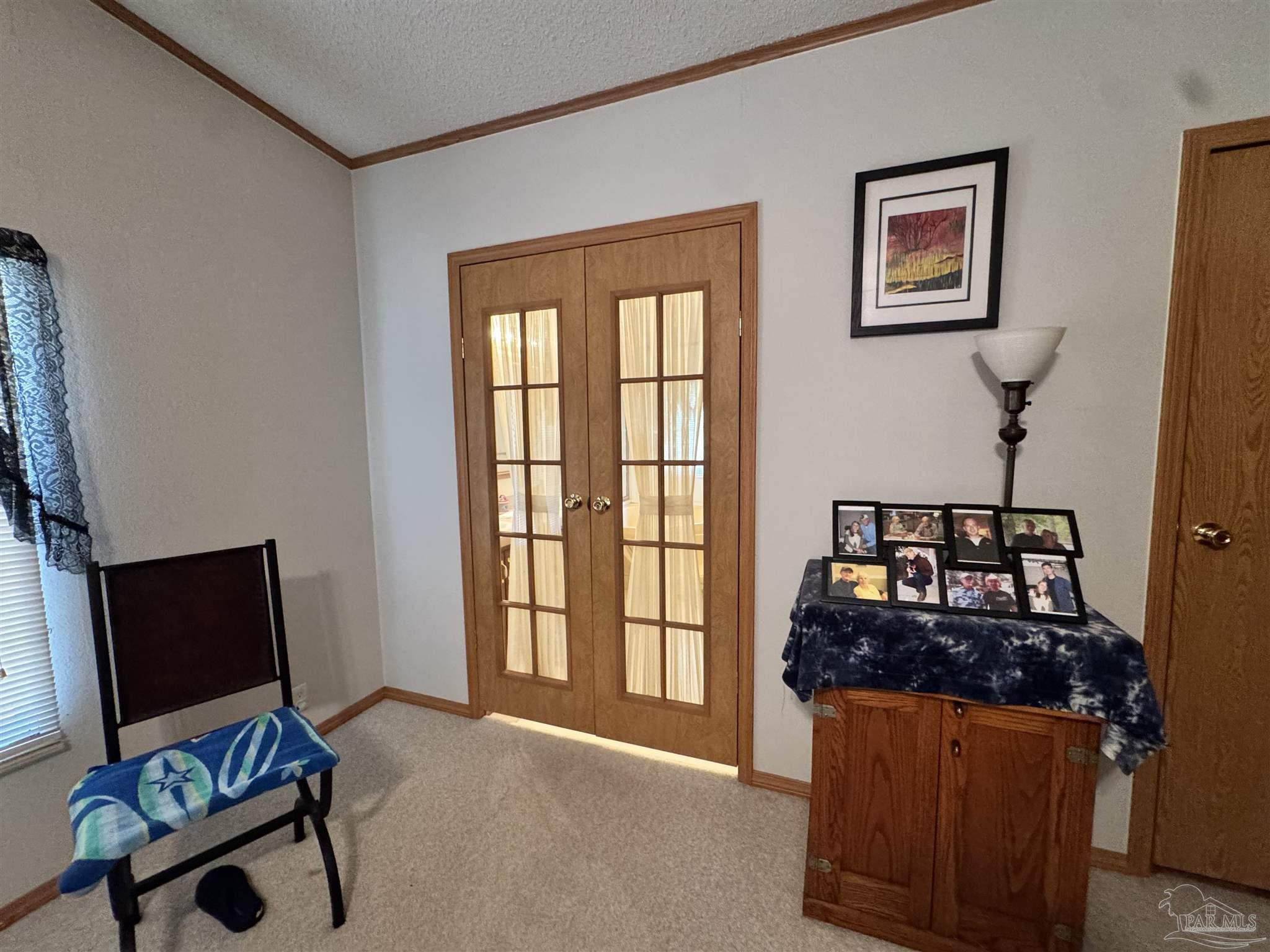 6512 Winston Brown Road Milton, FL 32570 - Photo 11 of 37 a living room with furniture and a flat screen tv