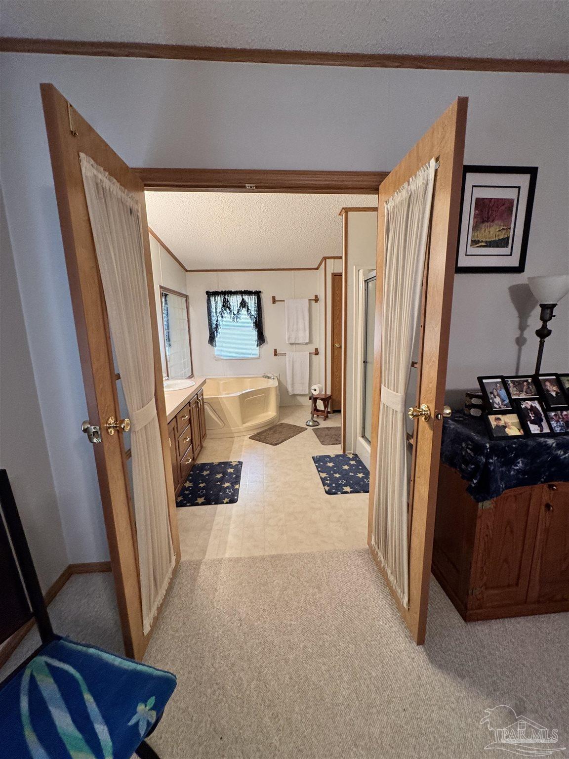 6512 Winston Brown Road Milton, FL 32570 - Photo 12 of 37 a view of a hallway with a bedroom