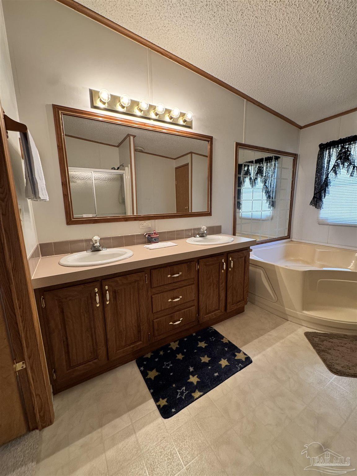 6512 Winston Brown Road Milton, FL 32570 - Photo 18 of 37 a kitchen with a cabinets and wooden floor