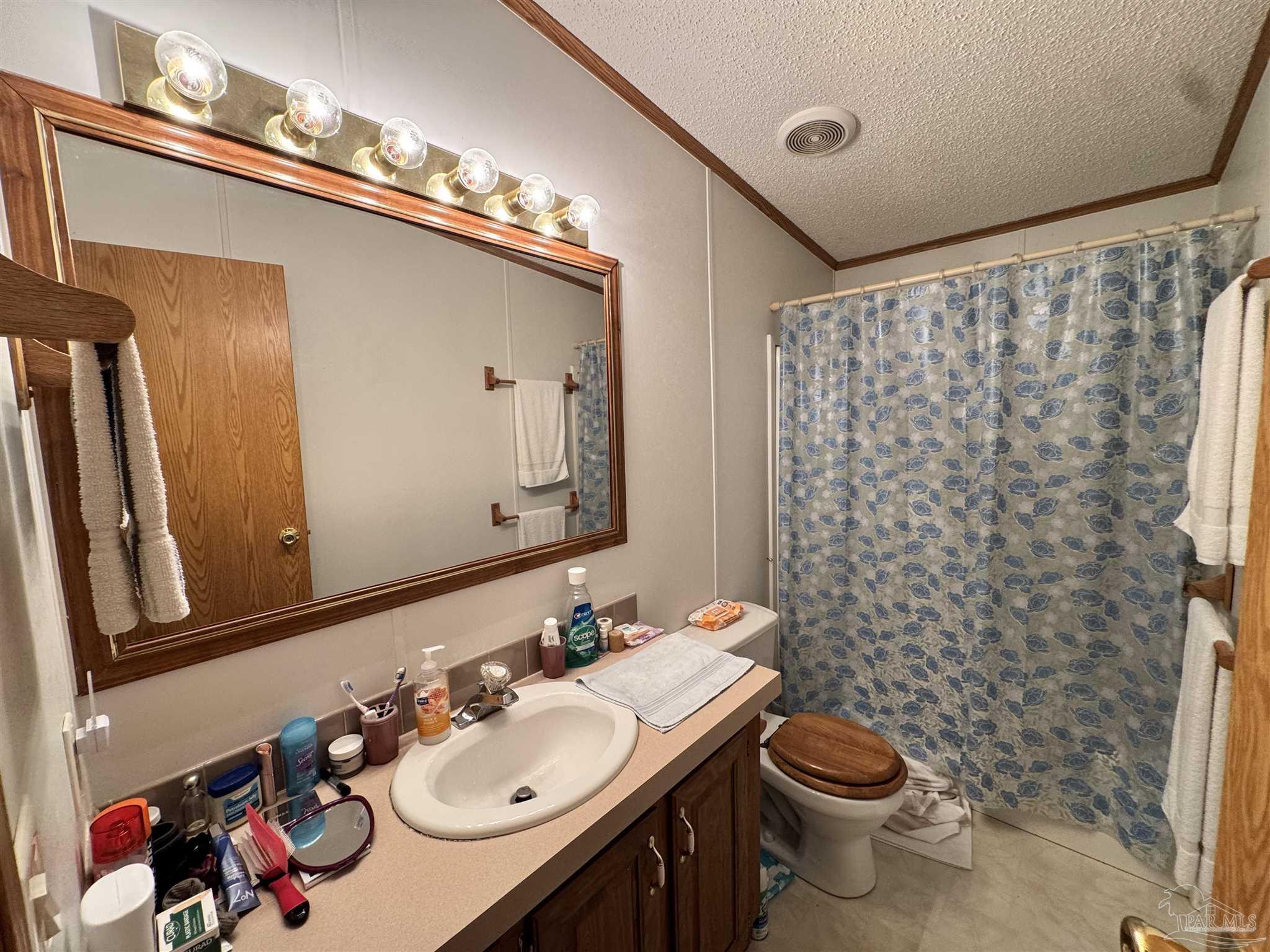 6512 Winston Brown Road Milton, FL 32570 - Photo 22 of 37 a bathroom with a sink and a mirror