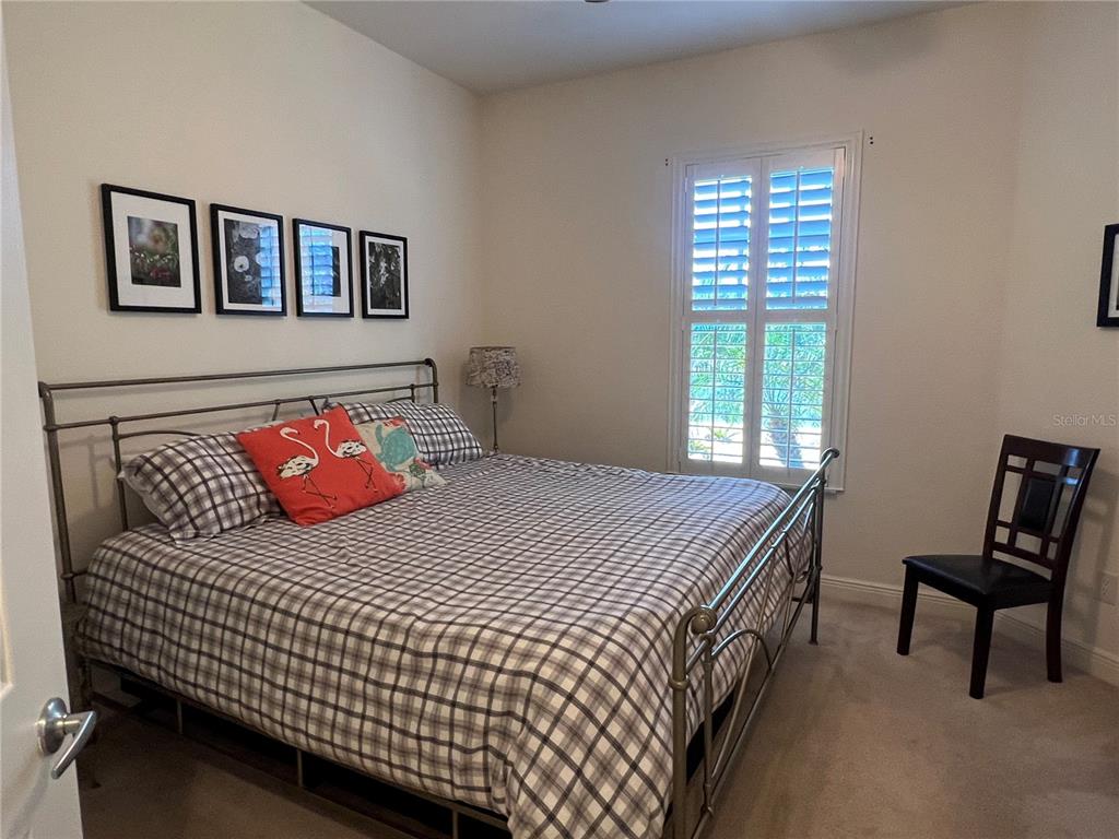 240 West End Drive, Unit 611 Punta Gorda, FL 33950 - Photo 17 of 19 a bedroom with a bed and a window