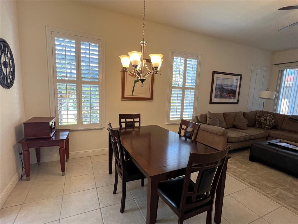 240 West End Drive, Unit 611 Punta Gorda, FL 33950 - Photo 5 of 19 a living room with furniture a window and a table