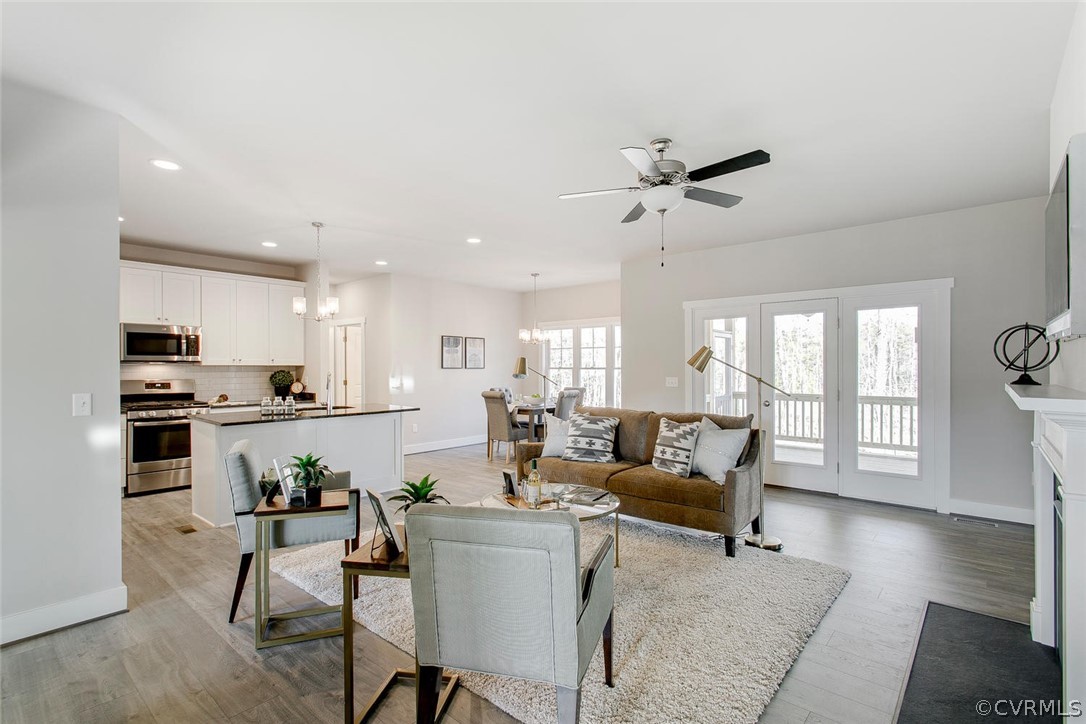11519 Avening Road Midlothian, VA 23112 - Photo 7 of 19 a living room with furniture dining table and a view of kitchen