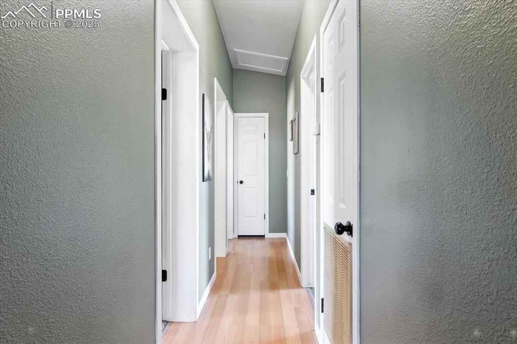 3316 Carlson Road Rye, CO 81069 - Photo 21 of 50 a view of a hallway with wooden floor and a bathroom