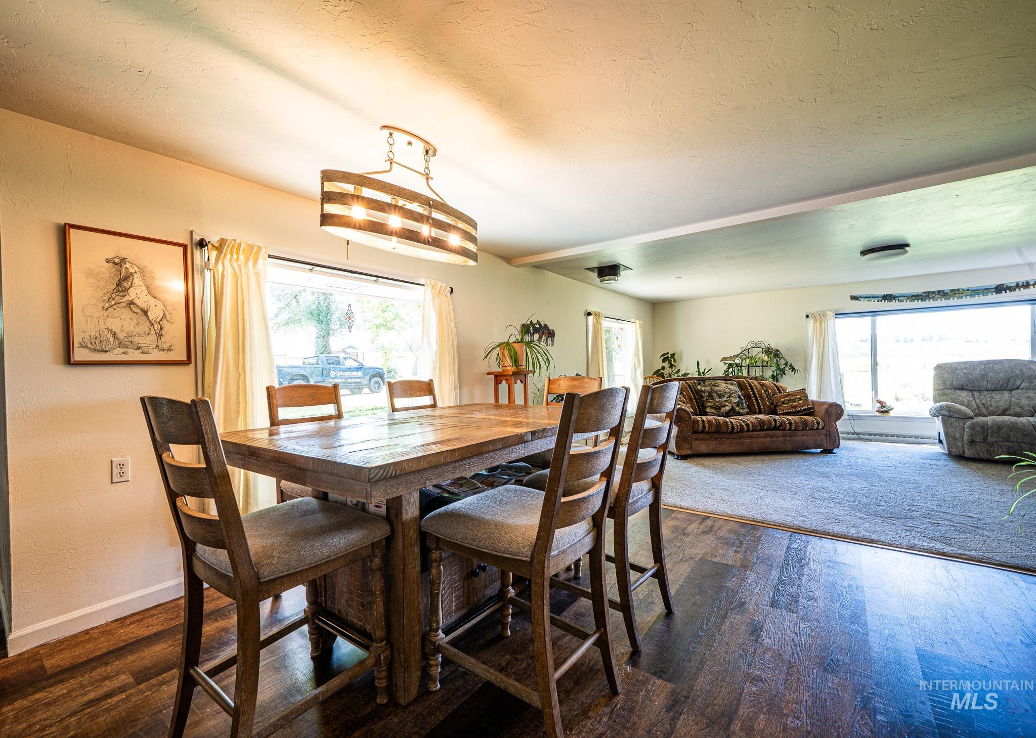 67 Jessup Road Grangeville, ID 83530 - Photo 15 of 49 Wood-finish flooring, recessed lighting, and a linear chandelier