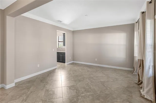 a white toilet sitting in a bathroom next to a sink
