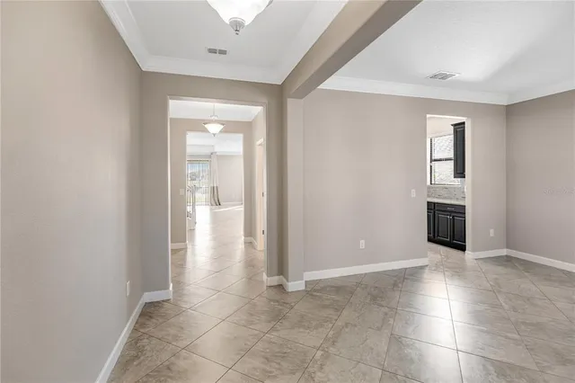 a kitchen with stainless steel appliances granite countertop a sink and a stove top oven with wooden floor