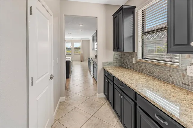 a kitchen with granite countertop stainless steel appliances and cabinets