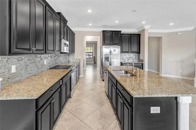 a view of a livingroom with a furniture a ceiling fan and window