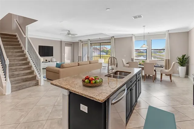 a view of an empty room with window and refrigerator
