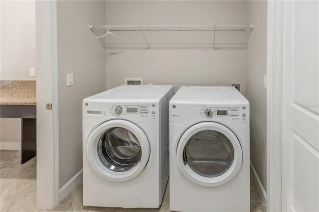 a white toilet sitting next to a white cabinet