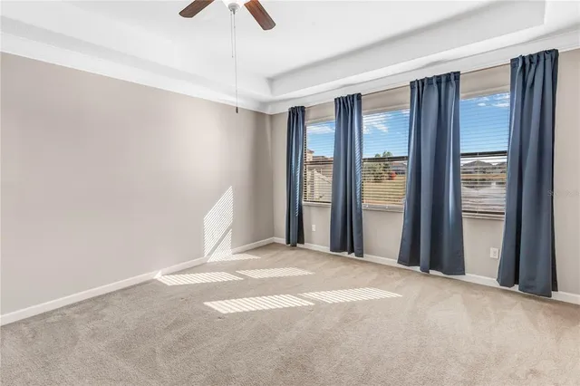 a white toilet sitting next to a bath tub
