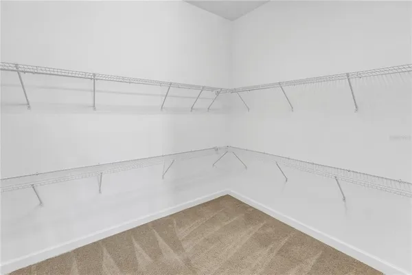 a view of a living room with a floor to ceiling window and floor to ceiling window