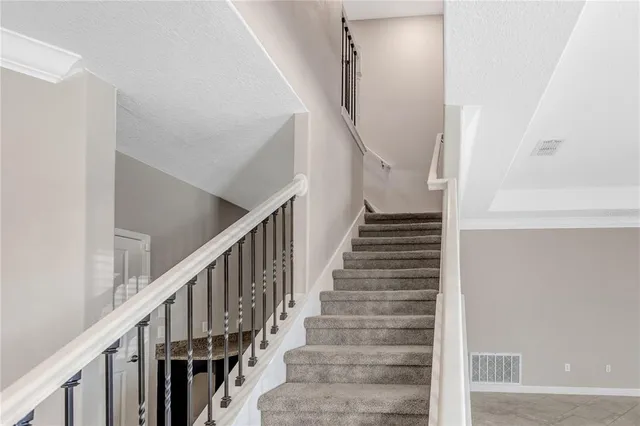 a view of an empty room with a balcony