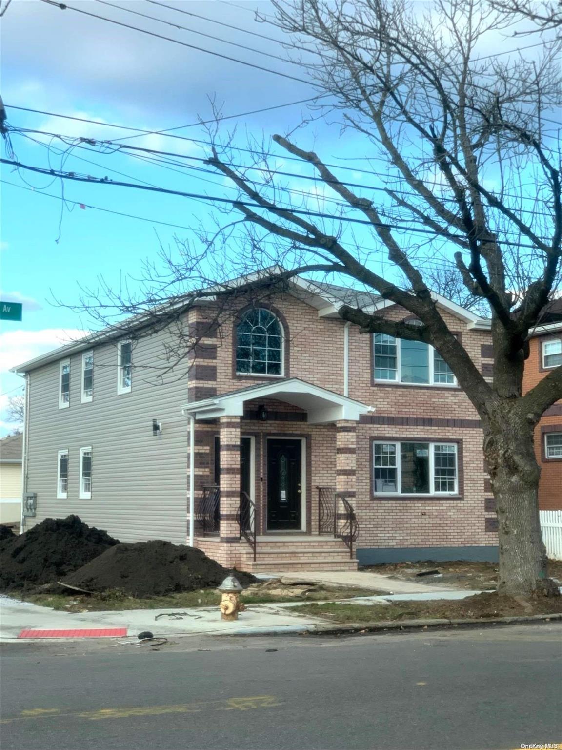 a front view of a house with yard